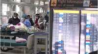 Kasdien mirštant tūkstančiams COVID-19 pacientų, kinai kraunasi lagaminus – tikisi Naujuosius sutikti svetur (nuotr. stop kadras)