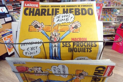 Žiaurų susidorojimą patyrusi „Charlie Hebdo“ vėl susilaukė grasinimų dėl karikatūros (nuotr. SCANPIX)