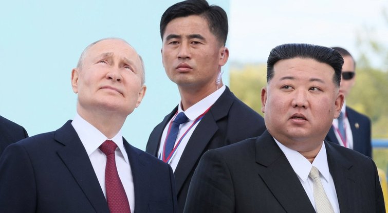 V. Putinas ir K. J. Unas (nuotr. SCANPIX)